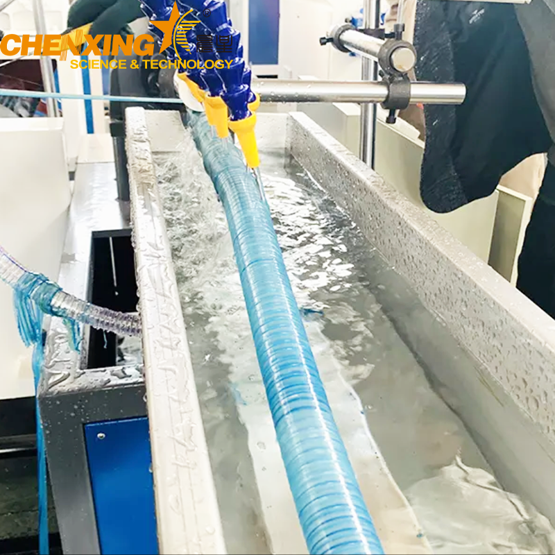 Cooling water tank and rotary haul-off system for spiral hose extrusion