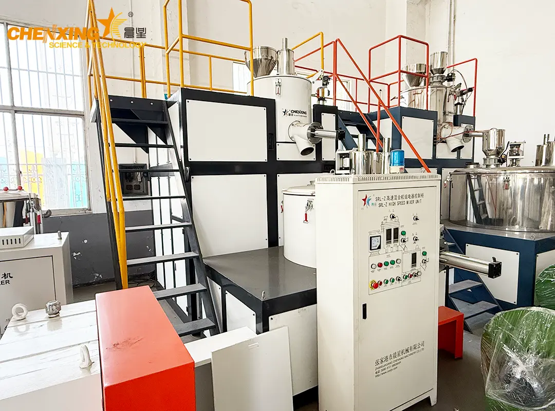 SRL-Z Series Vertical-Type Mixing Unit in a modern PVC compounding plant with blue-tinted industrial lighting